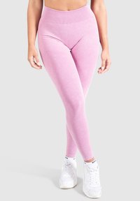 Leggings rosa a vita alta realizzati in materiale elasticizzato e liscio, con una vita a coste e una silhouette aderente.