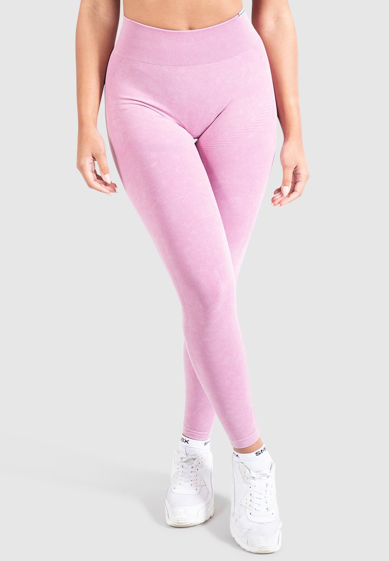 Leggings rosa a vita alta realizzati in materiale elasticizzato e liscio, con una vita a coste e una silhouette aderente.