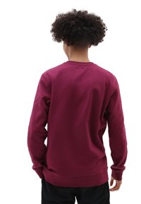 Sudadera burdeos de manga larga, diseño liso, con cuello y puños acanalados, y un ajuste relajado. Tela de algodón suave con una textura blanda.