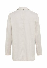 Lichtbeige linnen jas met een klassieke kraag, lange mouwen en een rechte snit. Beschikt over een enkele split aan de achterkant en subtiele stikdetails.