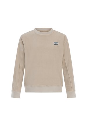 Sweatshirt en polaire beige à manches longues, avec un col et des poignets côtelés. Présente un petit patch logo bleu sur la poitrine. Texture douce.