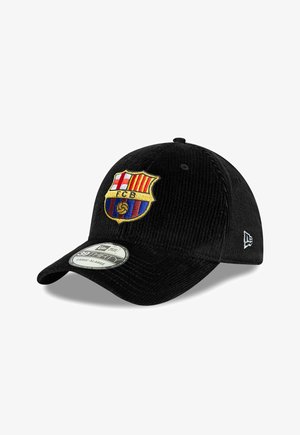 Black corduroy cap featuring an embroidered FC Barcelona logo on the front, rounded shape, and a curved visor. Size label on brim.