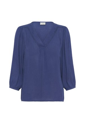 Blusa blu, ampia e morbida, con scollatura a V, maniche lunghe plissettate e cuciture decorative attorno al collo. Tessuto morbido e leggero.