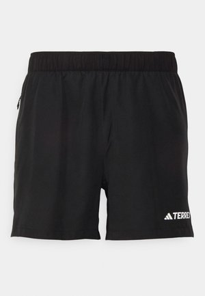 Pantaloni sportivi neri realizzati in tessuto leggero. Presentano un elastico in vita e una tasca con zip sul lato. Logo in basso a destra.