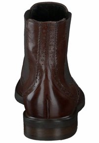 Botas de cuero marrón hasta el tobillo con paneles laterales elásticos, detalles de adorno de perfilería, y una suela baja y plana, con un acabado pulido y suave.