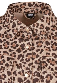 Leopard print shirt with collar, snap buttons, and flap pockets, in beige and brown tones, Urban Classics brand, size XS.