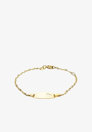 Złota bransoletka z twisted chain design, z płaską zawieszką z małym sercem wyciętym w środku. Regulowane zapięcie zapewniające pewne dopasowanie.