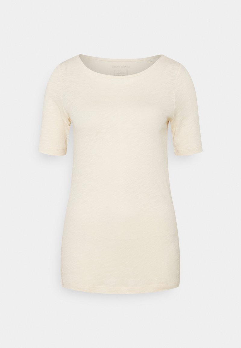 T-shirt beige clair à manches courtes avec un col rond et une finition texturée. Design simple sans motifs ni accents visibles.