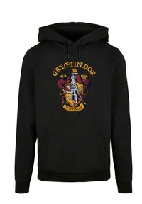 Czarna bluza z kapturem i kieszenią z przodu, z kolorową grafiką herbu Gryffindoru oraz napisem. Materiał wydaje się miękki, z kapturem ze sznurkiem.