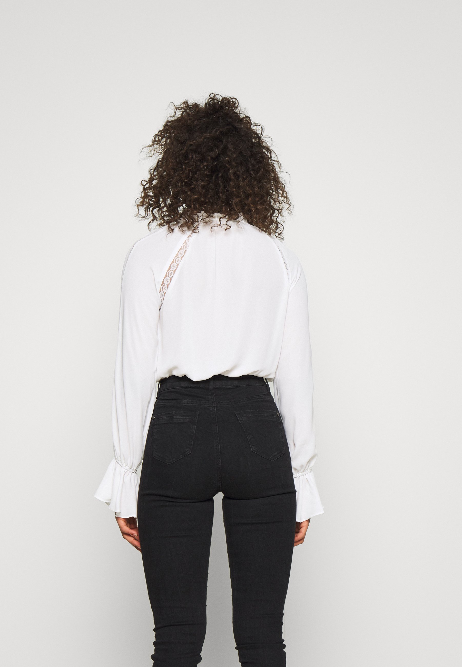 white blouse bodysuit