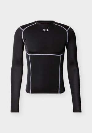 Melna garām piedurknēm sporta kompresijas krekls ar baltām šuvēm un Under Armour logotipu krūšu vidū.