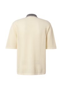 Chemise en tricot texturé à manches courtes couleur crème avec un col gris foncé et un léger bordure claire sur les manches et l'ourlet, vue de dos.