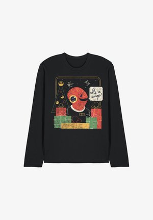 Black long-sleeve shirt featuring a retro graphic design with a red character, gifts in green and red, and a Christmas tree. Text reads "It's a wrap!"