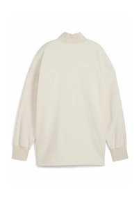 Cremefarbenes, übergroßes Sweatshirt mit hohem Kragen, geripptem Material und langen, leicht puffigen Ärmeln. Schlichtes Design, ohne Muster.