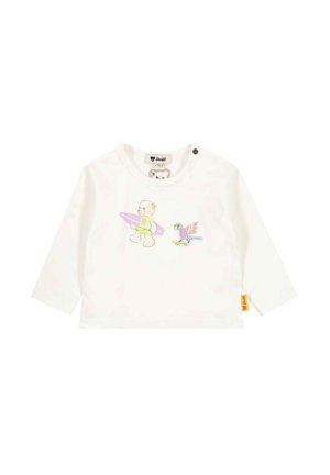 White long-sleeve baby shirt with printed bear holding a surfboard and a bird riding a skateboard on the front.