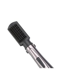 Spazzola per capelli con testa di setole nere arrotondata, manico in metallo argentato e interruttore di accensione. Le setole sono disposte in file per lo styling.