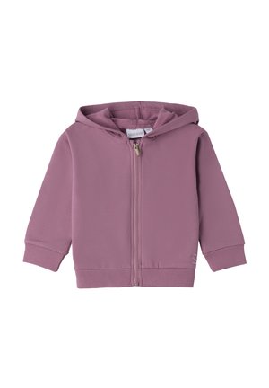Light purple zip-up hoodie with a hood, ribbed cuffs, and waistband, made from soft fabric. Features a small logo detail in the bottom corner.