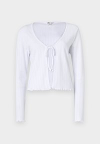 Vit långärmad croppad cardigan med djup V-urringning och knytframslutning. Har ribbad textur och scalloped nederkant.