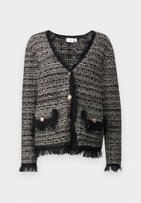Svart og hvit teksturert cardigan med V-hals, med frynse detaljer, to frontlommer og store dekorative knapper.