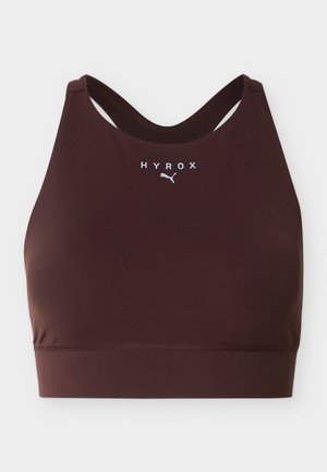 Dark brown sports bra with "HYROX" and Puma logo centered on front, featuring a racerback design and smooth fabric.