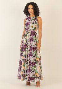 Maxime dress in kevyttä, läpikuultavaa kangasta, jossa on monivärinen kukkakuosi purppuran, oranssin ja vihreän sävyissä sekä joustava vyötärö.