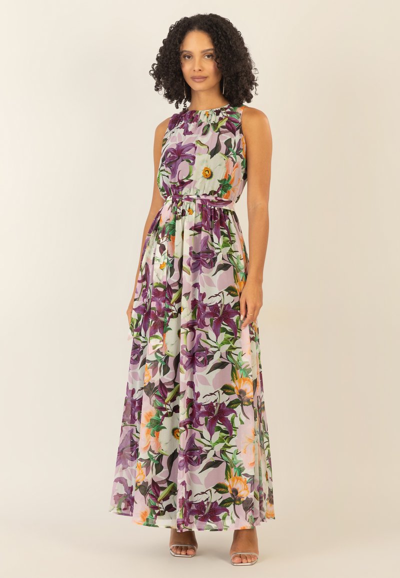 Maxime dress in kevyttä, läpikuultavaa kangasta, jossa on monivärinen kukkakuosi purppuran, oranssin ja vihreän sävyissä sekä joustava vyötärö.