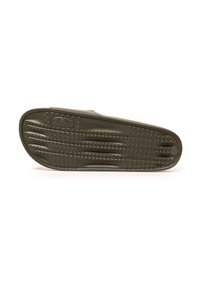 Suela de zapatilla de goma verde oscuro con agarre texturizado, que presenta estrías y pequeños puntos elevados para mayor tracción. Diseño ligero y flexible.