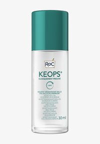 Flacon de déodorant roll-on en plastique transparent avec un capuchon teal, portant une étiquette blanche et du texte bilingue. Capacité : 30 ml. Sans aluminium.