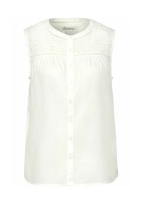 Ärmlös vit blus med en texturerad spets yoke, knappstängning, mjukt tyg och subtil samling vid bysten för en avslappnad passform.