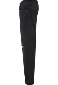 Mustat farkut slim fit -mallissa, joissa on kuluneet yksityiskohdat polvissa, klassinen viiden taskun muotoilu ja haalistunut pinta.