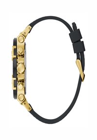 Uhr aus goldfarbenem Metall mit schwarzem Gummiband, ausgestattet mit mehreren Drückern und Kronen an der Seite. Glattes schwarzes Zifferblatt, strukturierte Akzente.