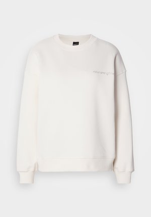 Sweatshirt branco feito de um material em mistura de algodão. Apresenta um decote redondo, ombros caídos e um discreto texto bordado no peito.
