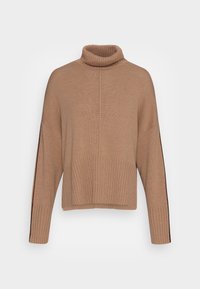 Beżowy sweter z golfem, wykonany na drutach, o luźnym kroju, z prążkowaną teksturą i kontrastującymi paskami wzdłuż rękawów. Skrócona długość i szerokie rękawy.