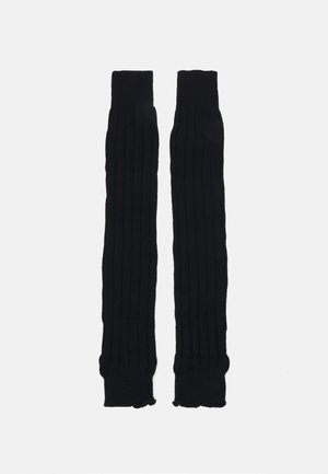 Gants de bras en tricot noir avec une texture côtelée, dotés de poignet élastique en haut et à l'ourlet pour un ajustement parfait, au design allongé.