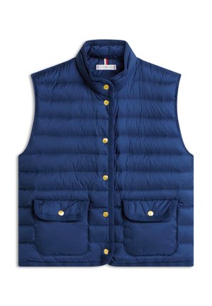 Μπλε πουά αμάνικο γιλέκο με χρυσά κουμπιά με πατιλέτα και δύο εμπρόσθιες τσέπες με καπάκια, γιακάς που στέκεται, ετικέτα Tommy Hilfiger μέσα στον γιακά.