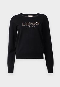 Pull noir à manches longues avec col rond, ornée de "LIU·JO 1995" en sequins rose doré sur la poitrine.