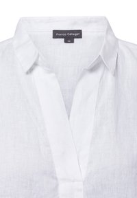 White linen blouse with a collared neckline, a deep V-placket, and a label reading "Franco Callegari 36." Smooth, light texture.