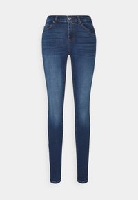 Pantalones vaqueros skinny de color azul oscuro, fabricados en denim. Cuentan con una cinturilla alta, cinco bolsillos y detalles de costura a lo largo de las costuras.