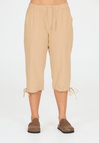 Vaaleanbeige, kevyt  cropped-housut, joissa on joustava vyötärö, nyöritys ja kaksi sivutaskua; helman säätöä varten on nauhoja.