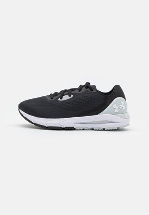 Black athletic shoe with a textured mesh upper, cushioned white sole, and light gray accents. Features traditional lacing system.