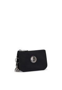 Portafogli in nylon nero con forma arrotondata, dotato di un emblema del logo argentato e un piccolo ciondolo in metallo. Chiusura a zip e attacco per chiavi.
