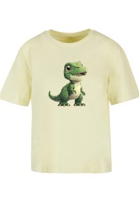 Gelbes Baumwoll-T-Shirt mit einer grünen Dinosaurier-Grafik auf der Vorderseite. Kurzärmlig und mit rundem Ausschnitt, glatte Textur.