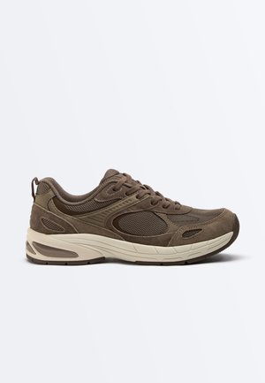 Brown mesh and suede sneaker with beige cushioned sole and lace-up closure shown in side profile on white background.