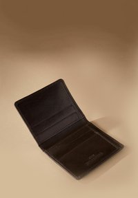 Brown leather wallet with a textured finish, featuring multiple card slots and a compartment for cash, opened against a neutral background.