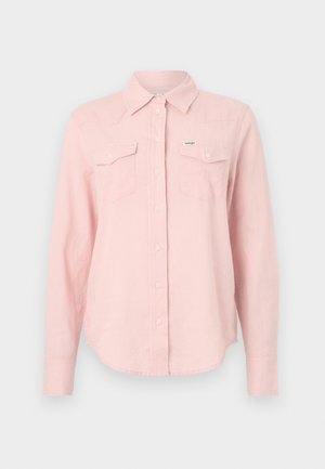 Light pink long-sleeve shirt with a collar, two chest pockets, button-down front, and curved hem. Made from a soft, textured fabric.