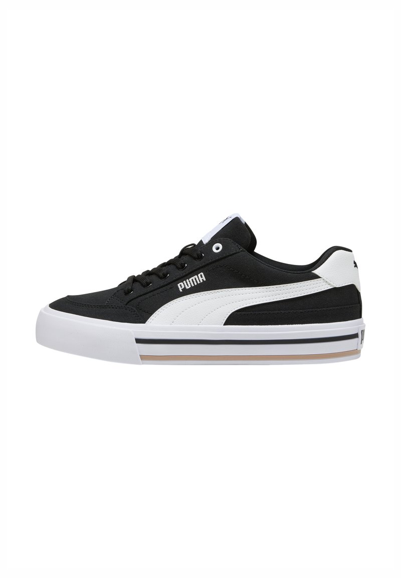 Sneaker bianco e nero con tomaia in tela testurizzata, design con lacci, collo imbottito e suola in gomma con accenti a strisce.