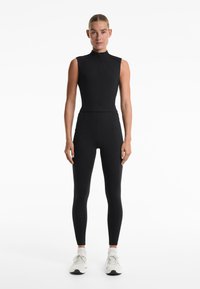 OYSHO EVERMOVE CREASE - Top - black