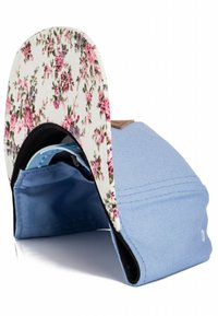 Cap with a light blue cotton body, floral-patterned brim in white, pink, and green. Features a black underside and tan leather patch detail.