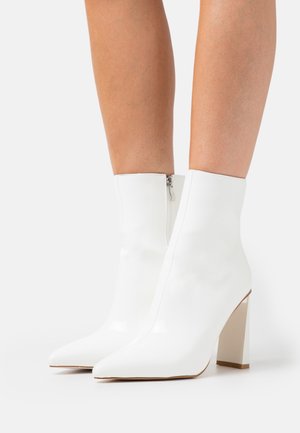 ELEXIS - Classic ankle boots - white