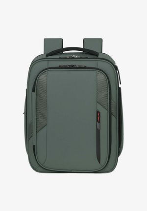Green rectangular backpack with top handle, padded shoulder straps, front zippered compartments, and subtle mesh side panels.